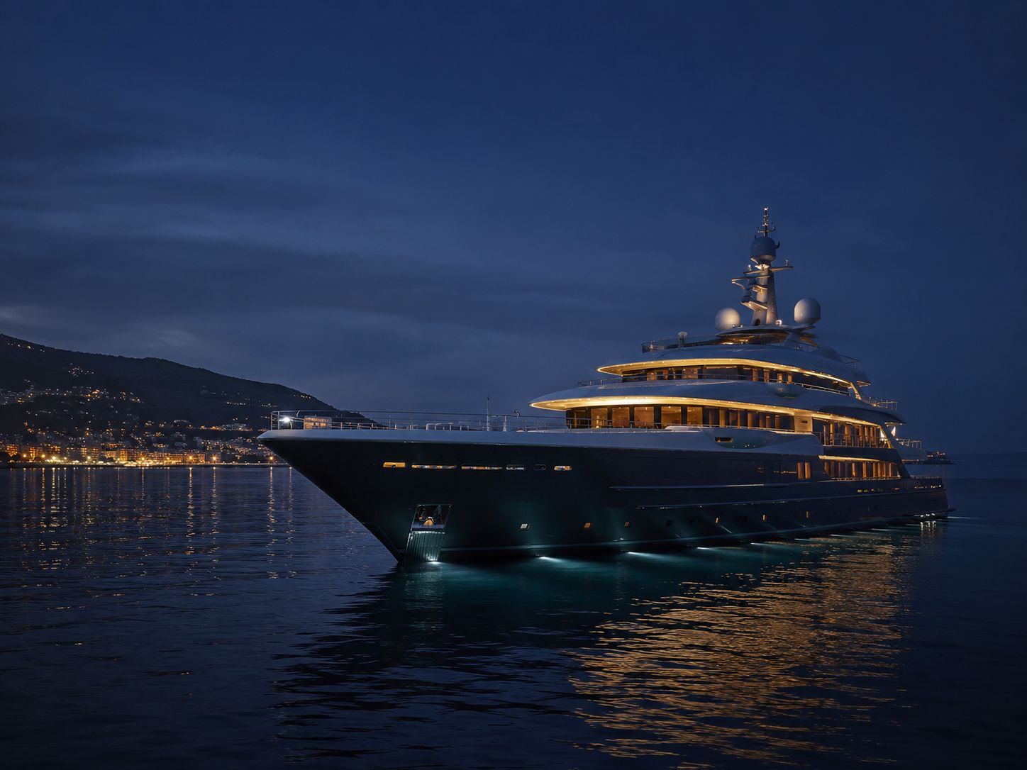 A yacht at anchor after dark